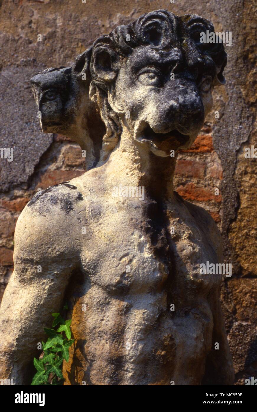 Detail of full-length humanoid with a demonic, or monstrous, head, in the gardens of the Roman Theatre a t Vincenza. Stock Photo