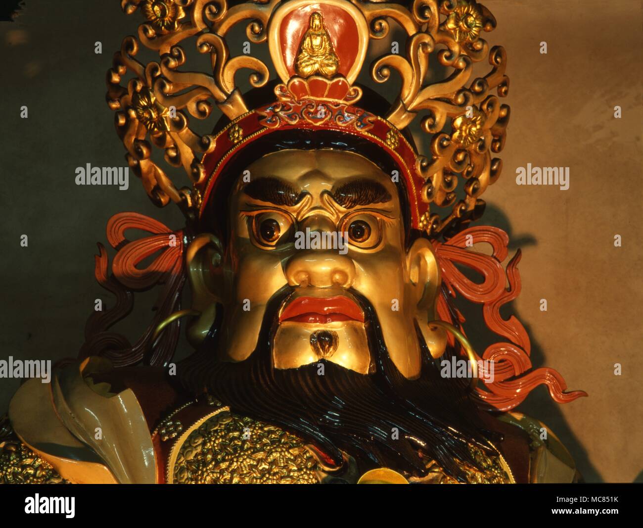 Demonic guardian of he East, sometimes called Mo-Li Ch'ing, bearer of the magical sword of the Four Elements. In the Chinese Buddhist monastery of Lantau Island, near Hong Kong. Stock Photo