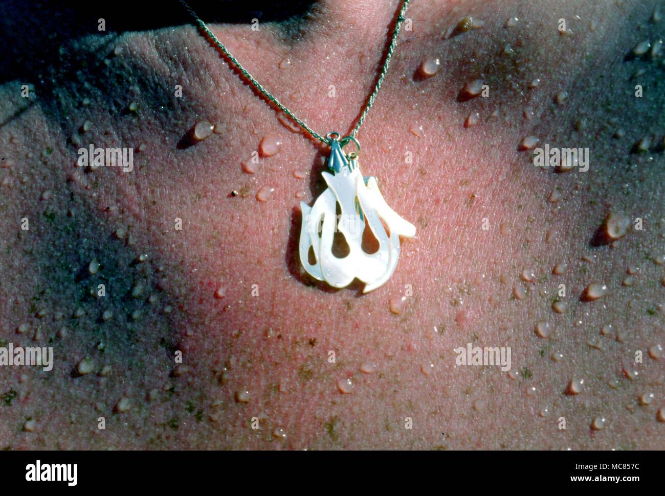 Amulets Islamic Stylized calligraphic name of God, used as a pendant amulet Stock Photo