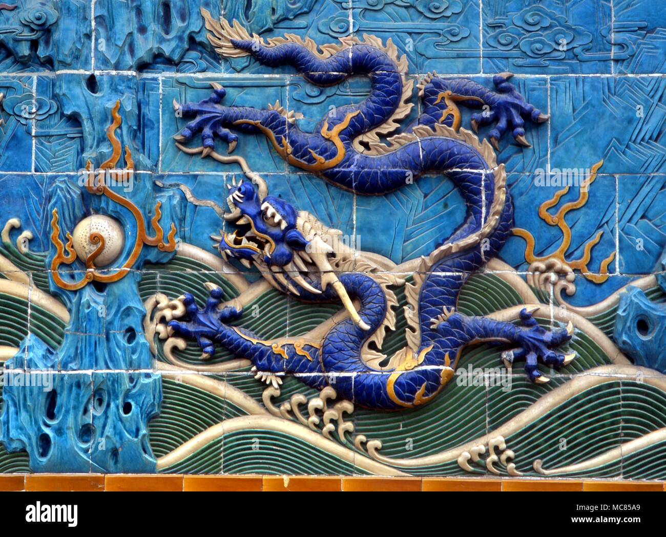 One of the nine imperial dragons on the Nine Dragon Screen (Jiu Lung Bi) of the Ming Dynasty. The screen is located in Bei Hai Park, Beijing, and is one of the most famous landmarks in the city. Stock Photo