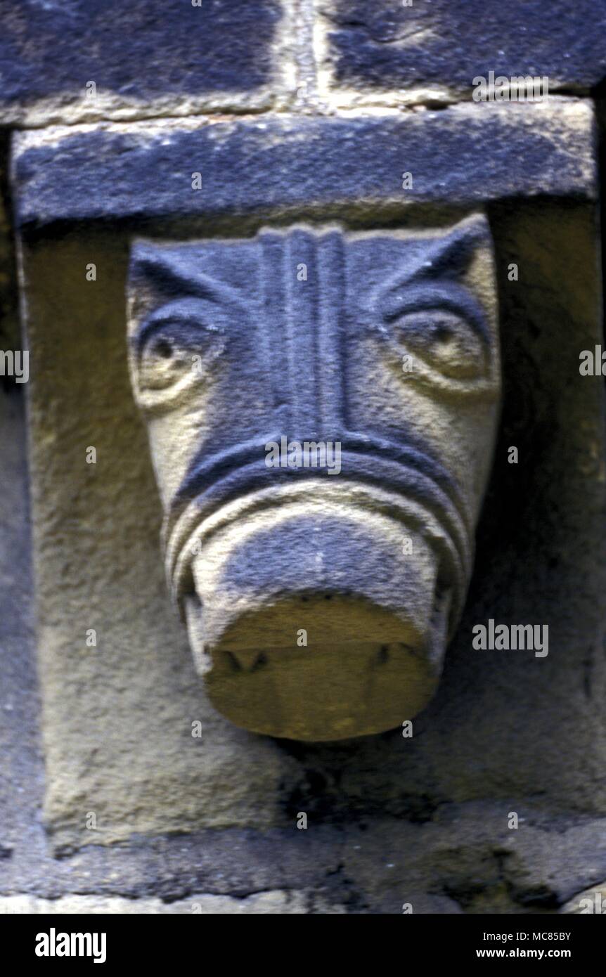 Grotesque head, corbel on the south wall of Adel Parish church. Probably fourteenth century, 1300's Stock Photo