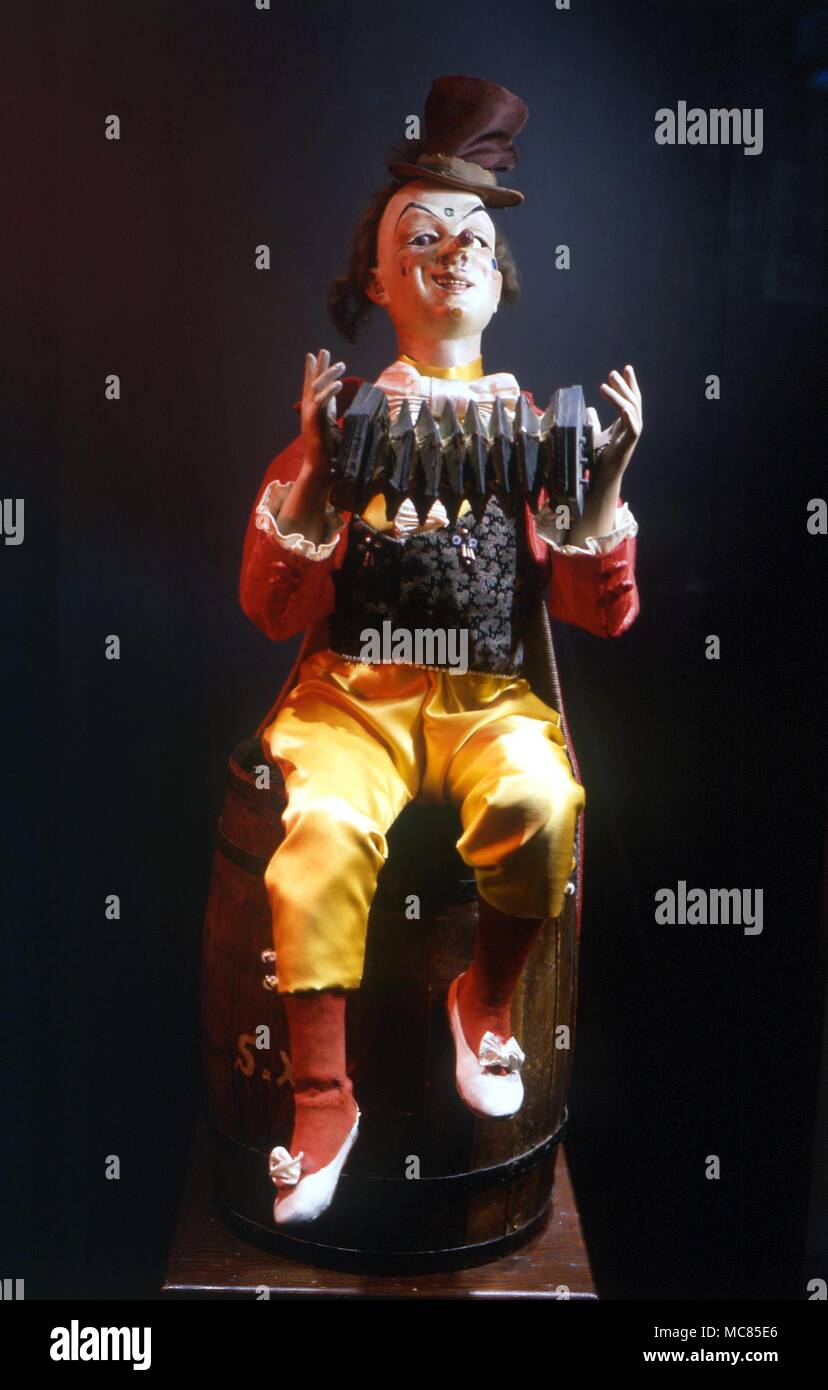 'Claude the Clown' an automato made by the Vichy Firm, circa 1890. This clown plays the concertina, taps his toes and moves his eyes. From the Museum of Automata, York Stock Photo
