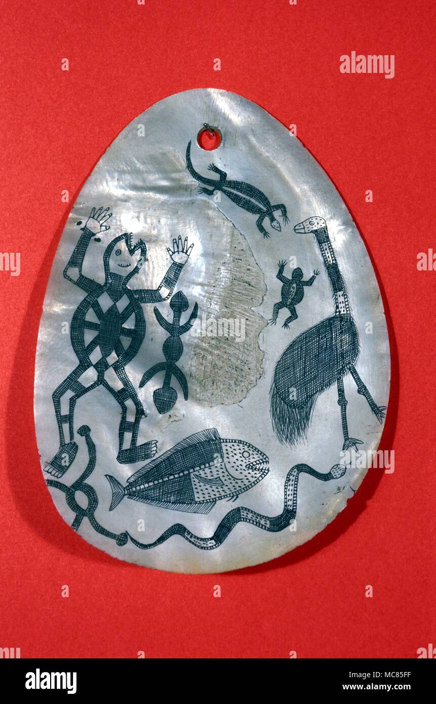 Pubic shield, formerly worn by the Aboriginal natives of Australia. The shell is inscribed with mythological figures. Stock Photo