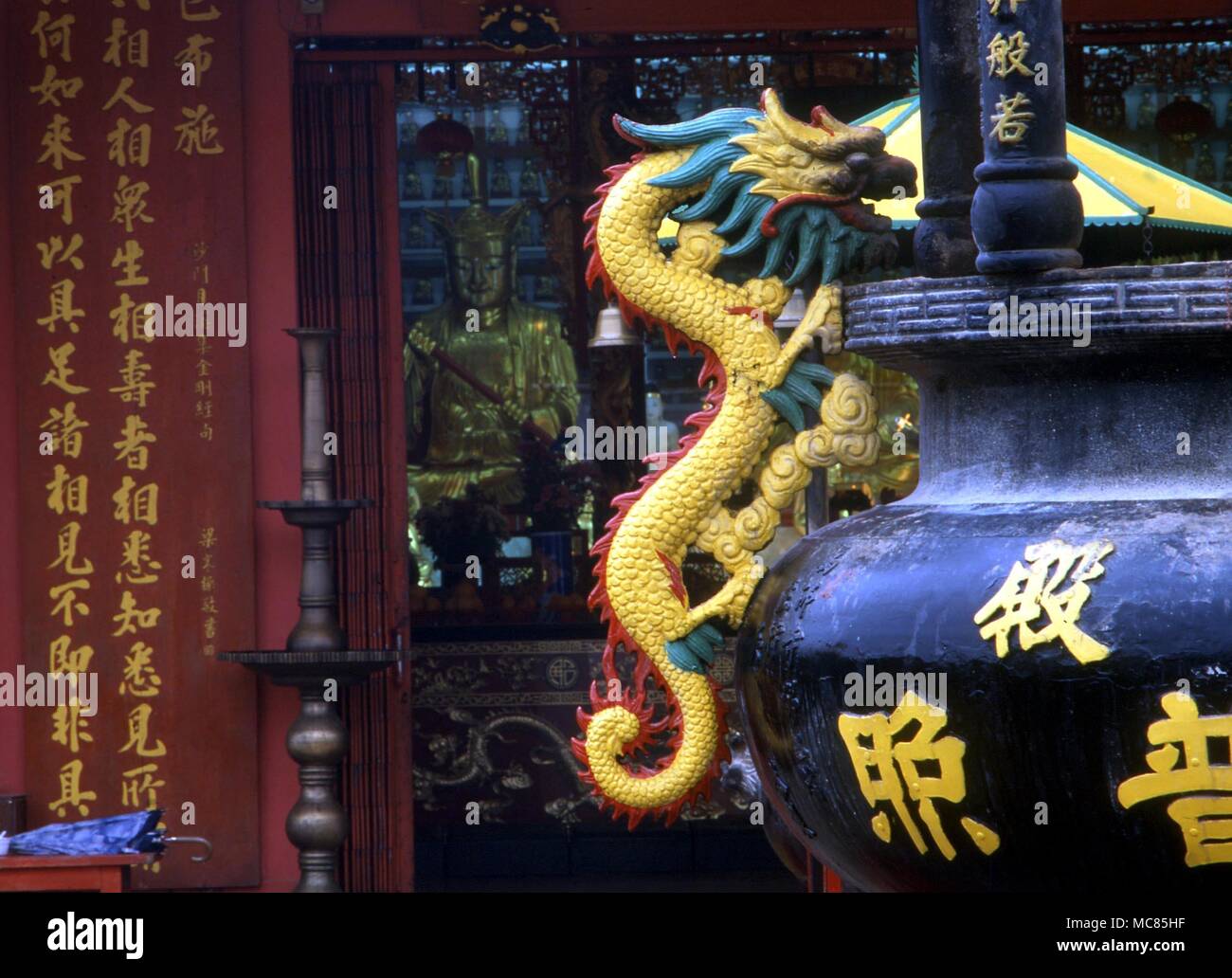 Chinese mythology. The cult of the dragon may be traced to prehistoric images. Dragon on giant incense burner in the courtyard of the Temple of a Thousand Buddhas, Sha Tin. Stock Photo