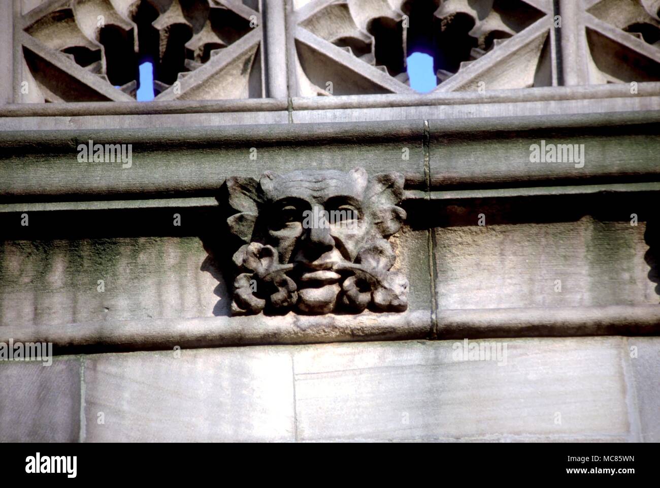 Green Man with double foliage, as frieze decoration on the west facade of Manchester Cathedral Stock Photo