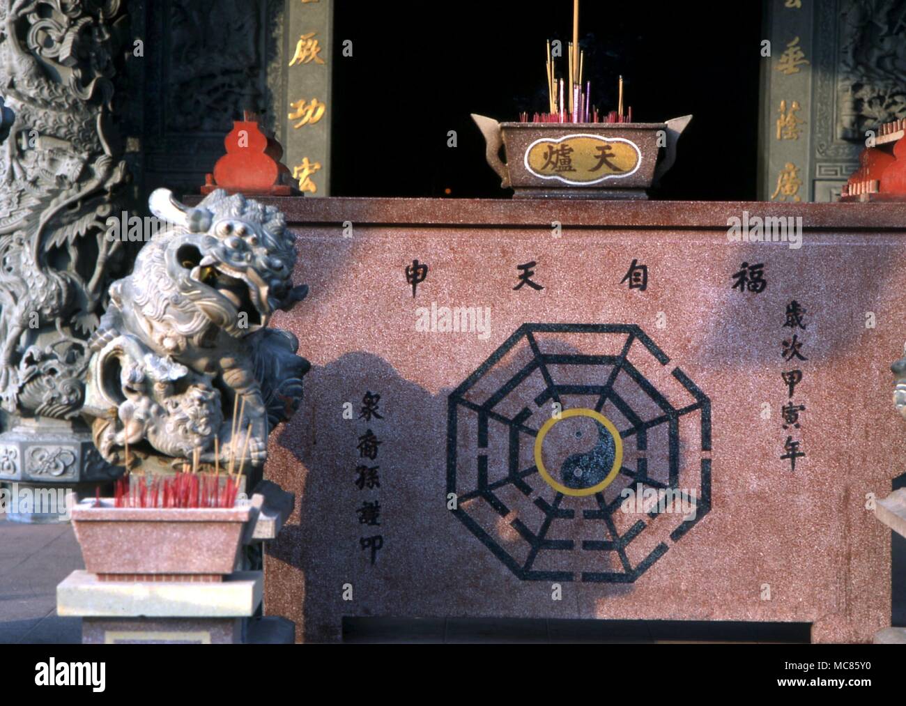 I Ching The Tai Chi, with the pa qua right (or eight trigrams of the I Ching), on an altar in a Taoist Chinese Temple in Penang, Malaysia Stock Photo