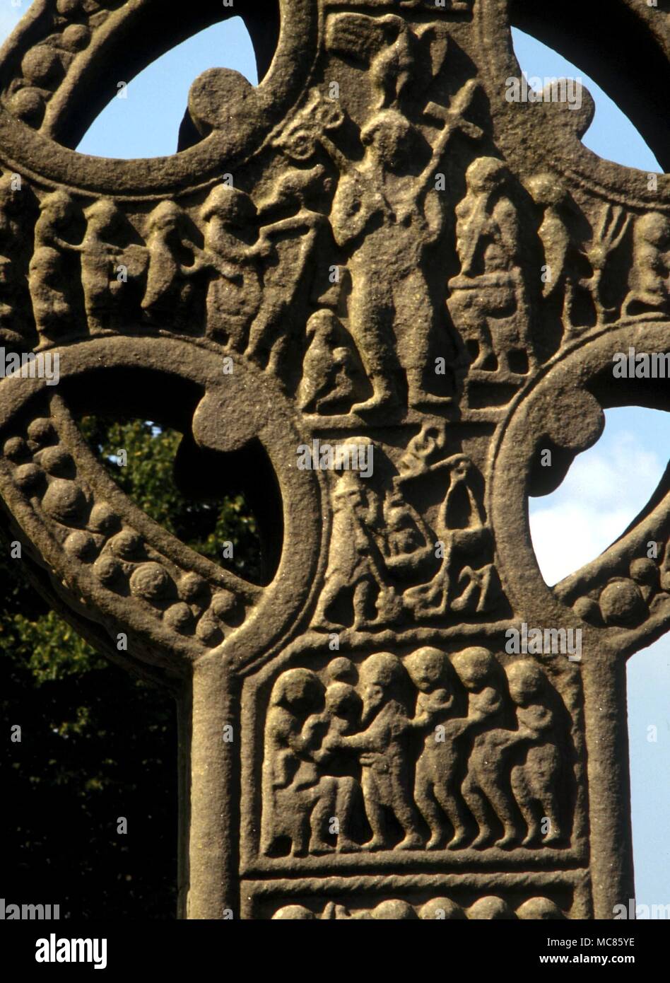 CHRISTIAN Last Judgement. Detail of central boss of the 10th century 'South Cross' at Monasterboice, with The Last Judgement theme. Christ holds the cross and the flowering rod. Below is Michael with the scales. The cross is 18 feet high, sometimes called Muiredach's Cross Stock Photo