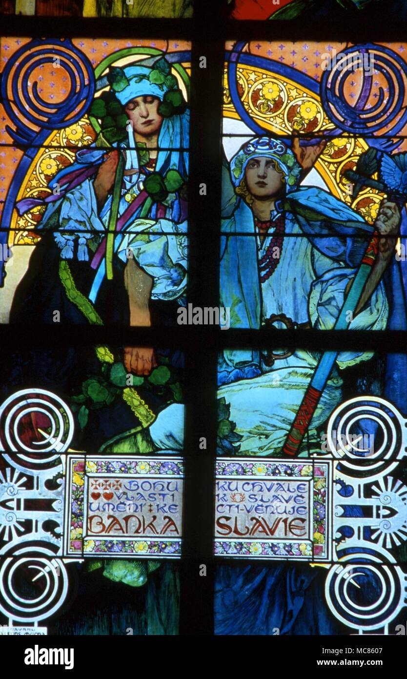 CHRISTIAN Stained glass window in the Archbishop's Chapel in St Vitus Cathedral, at Prague Castle. The design was by Alfons Mucha Stock Photo