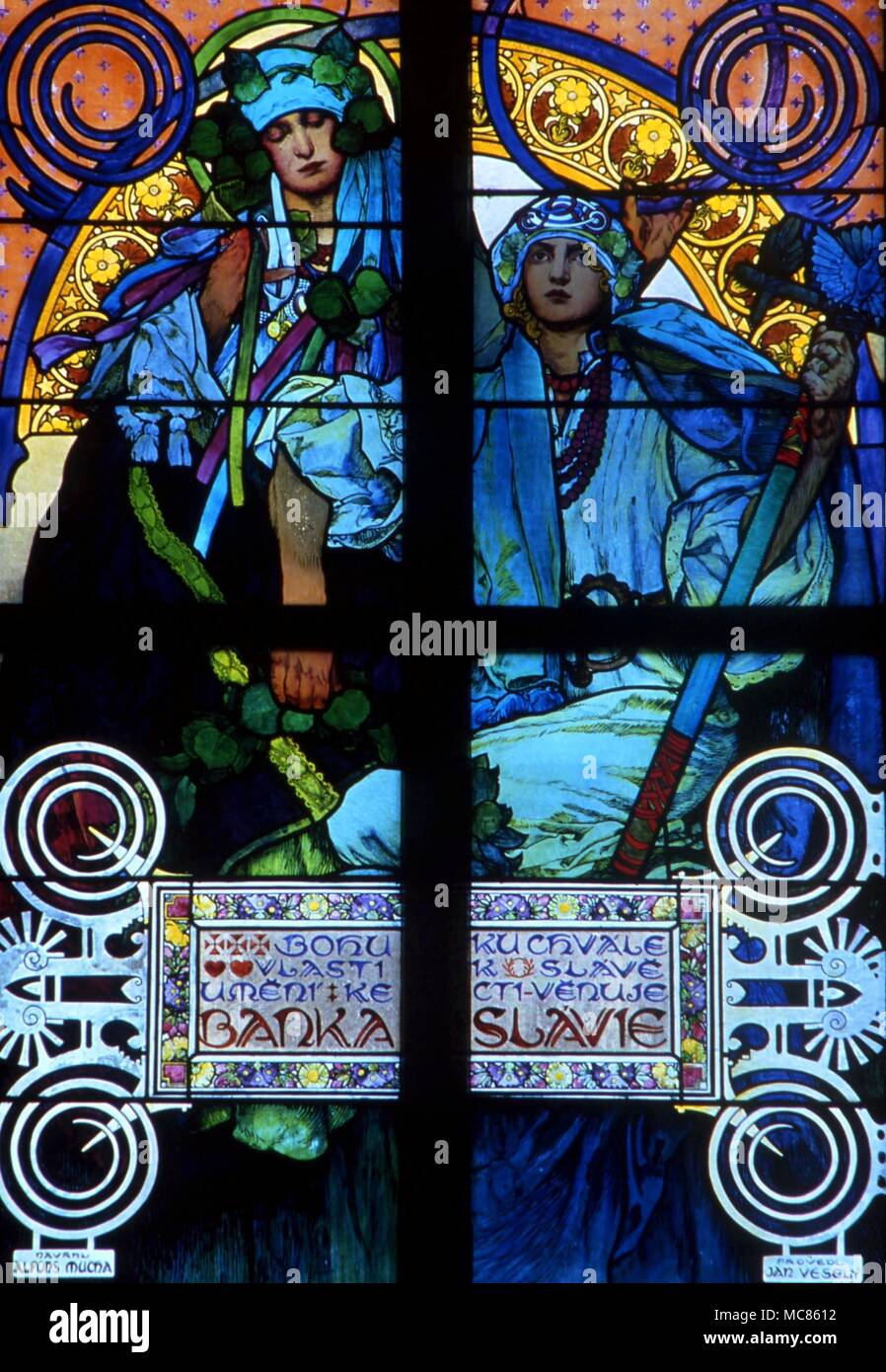 CHRISTIAN Stained glass window in the Archbishop's Chapel in St Vitus Cathedral, Prague Castle. Design by Alfons Mucha Stock Photo