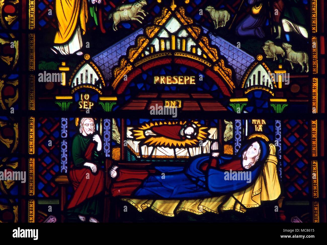 CHRISTIAN Jesus in the Crib, with the Virgin and Joseph. Stained glass of the 19th century, from cathedral at Southwell Stock Photo