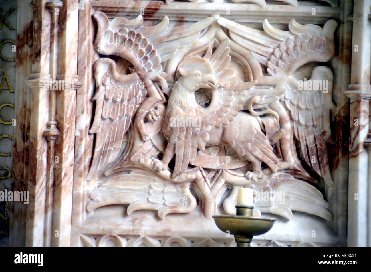 CHRISTIAN - St John Ornate bas relief of the Evangelist John, with the head of an eagle, derived from the image of Scorpio. Panel of marble altar in St David's cathedral Stock Photo