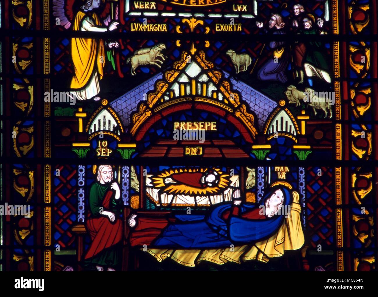 CHRISTIAN - Jesus in the crib with the Virgin and Joseph. Stained glass of the 19th century, from cathedral at Southwell Stock Photo