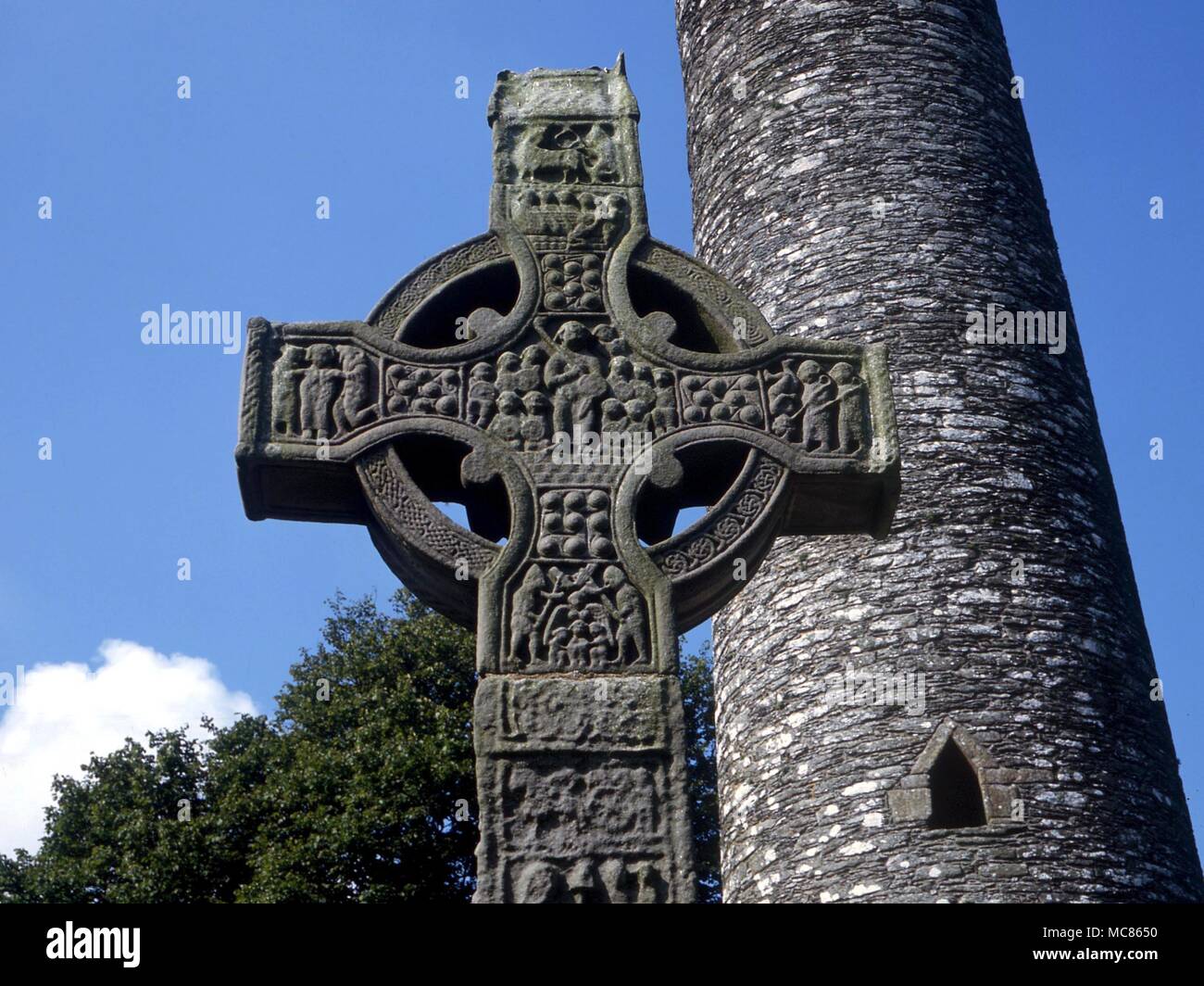 CHRISTIAN - Last Judgement. Detail of central boss of the 10th century 'South Cross' at Monasterboice, with The Last Judgement theme. Christ holds the cross and the flowering rod. Below is Michael with the scales. The cross is 18 feet high, sometimes called Muiredach's cross Stock Photo