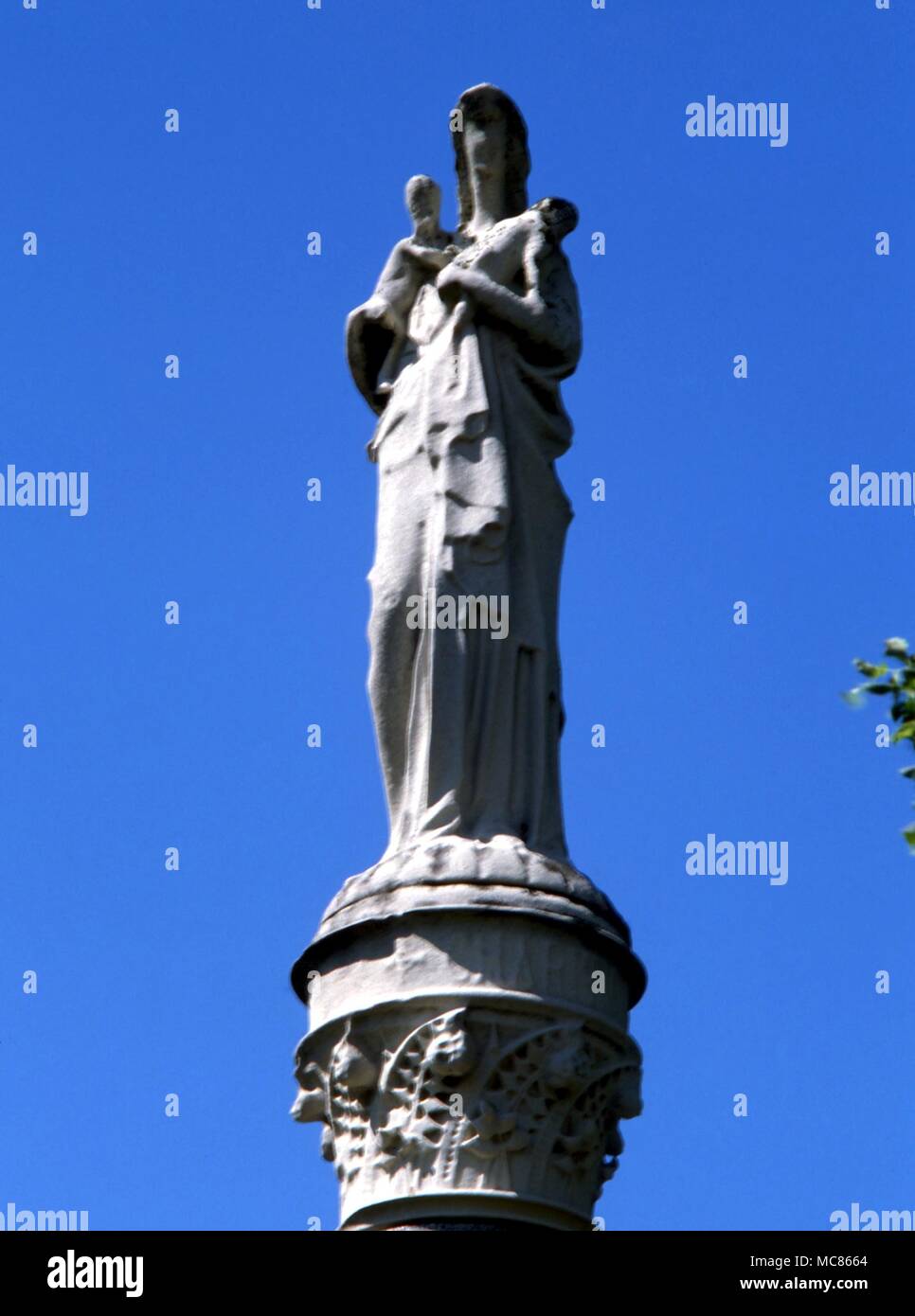 CHRISTIAN Statue portraying charity, on the finial of the tomb of a former mason, Littleborough churchyard Stock Photo