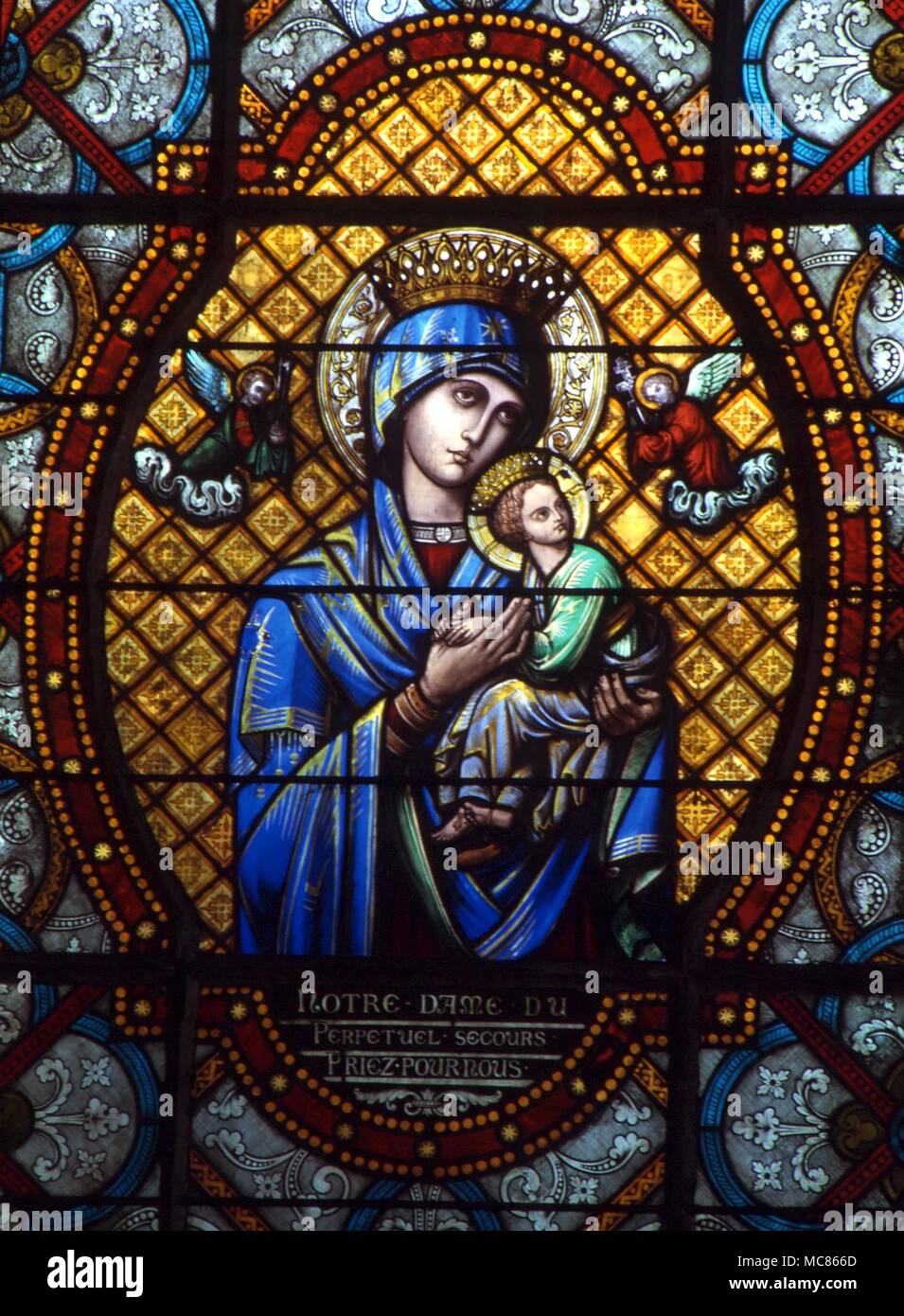 CHRISTIAN Virgin and Child 'Our Lady of Pepetual Secour' - stained glass in the church of St Pierre, Chartres, France Stock Photo