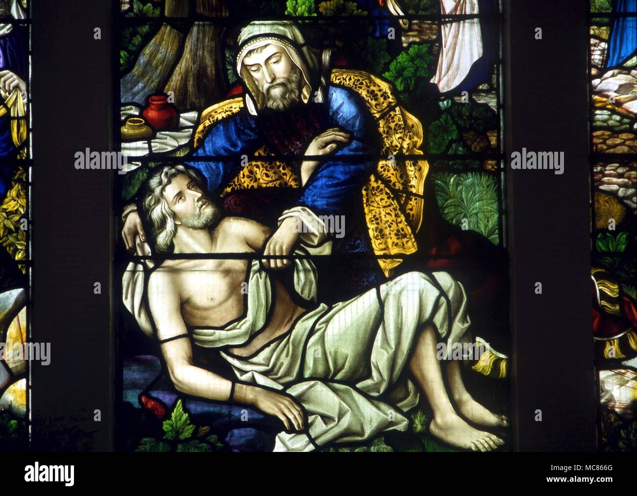 CHRISTIAN The Good Samaritan - 19th century stained glass, in the church of Newchurch-in-Pendle Stock Photo