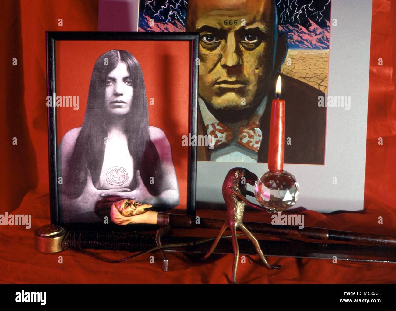 Consecrated candle, carried by the Egyptian Thoth (Dahomey derivative) in front of a portrait of Aleister Crowley and his mistress, Waddell Stock Photo