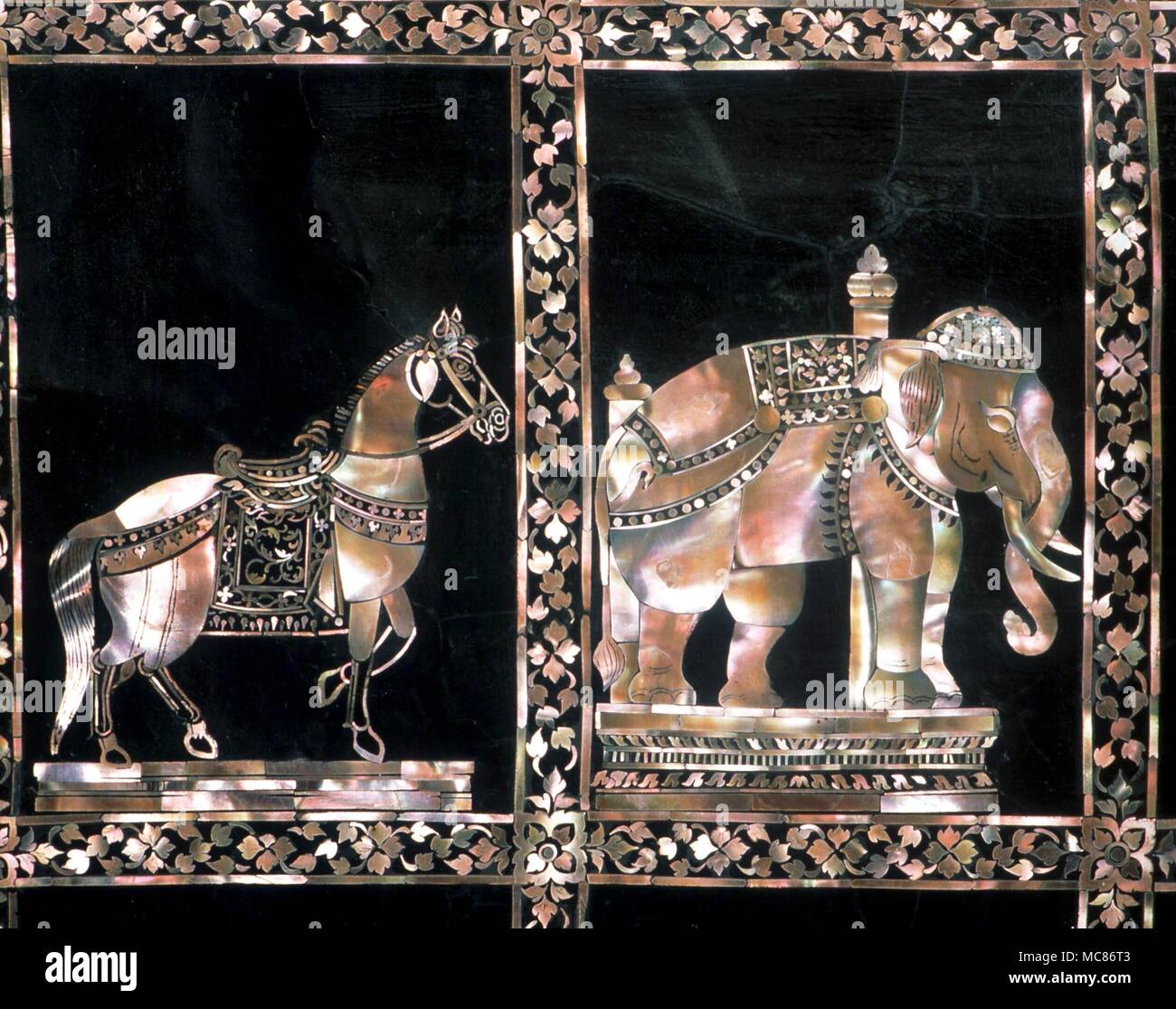 REINCARNATION The animals of the Buddhist Jakata tales are said to symbolize the previous incarnations of the Buddha. Mother-of-Pearl inlay images of the Elephant and Horse, set in the feet of the giant Buddha in the Imperial Palace, Bangkok Stock Photo