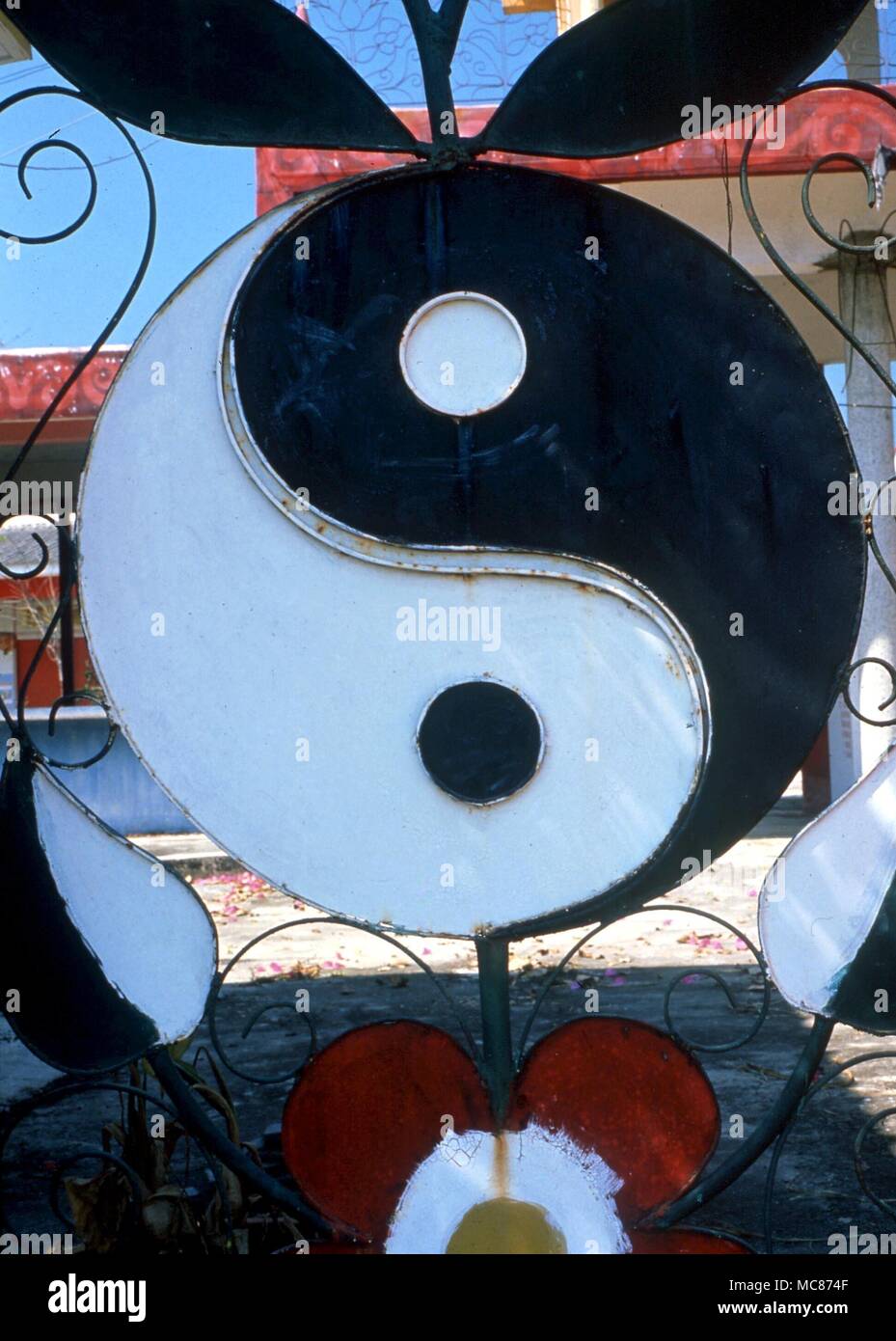 TAI CHI - The Tai Chi symbol which combines in one figure - the Yin (darkness) and the Yang (light). from a decorative Chinese gate, near Bangkok Stock Photo