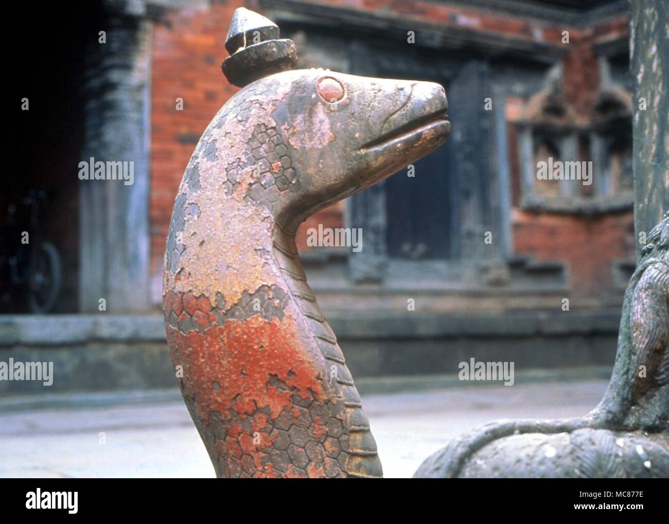 Rearing snake (naga) around the Buddhist well, or royal bath (dated circa 1670) in the Tusa Hiti, Patan, Nepal Stock Photo