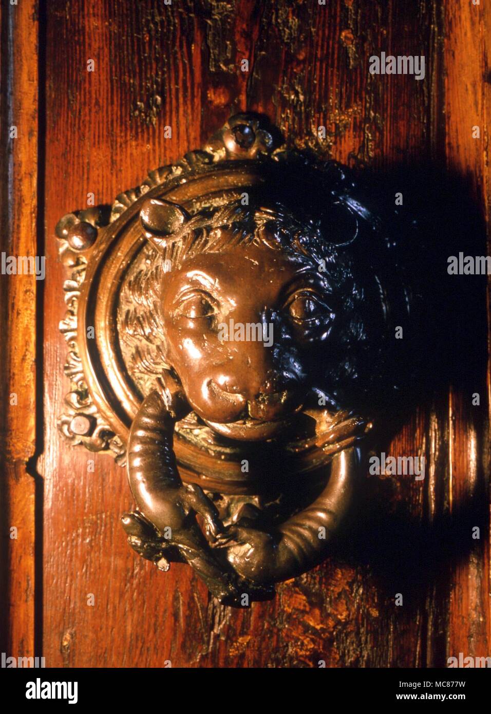 The medieval sanctuary knocker in the Boston Stump. The head is in the image of a lion, the handles in the form of salamanders Stock Photo