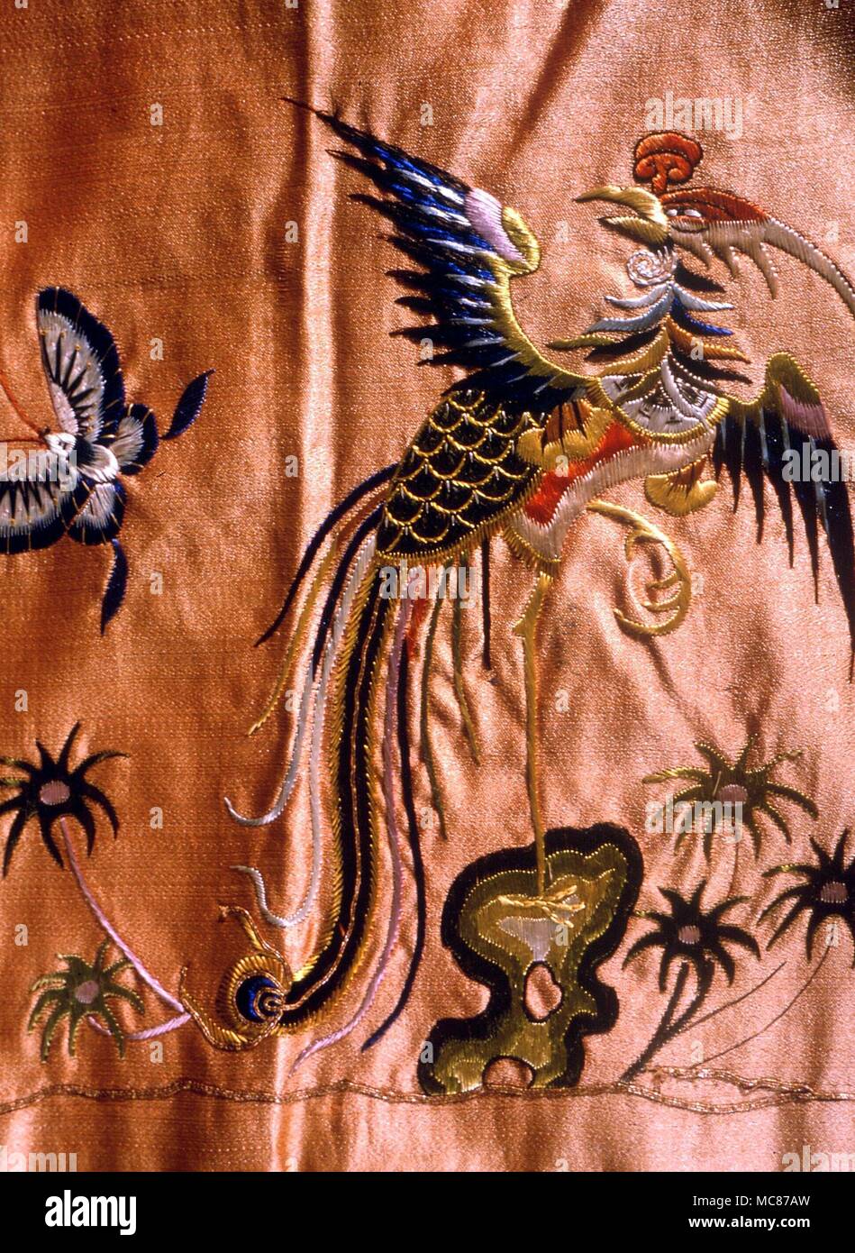 Chinese partridge embroidered on a Chinese silk. The partridge is sometimes confused with the Phoenix, though the latter has a long neck Stock Photo