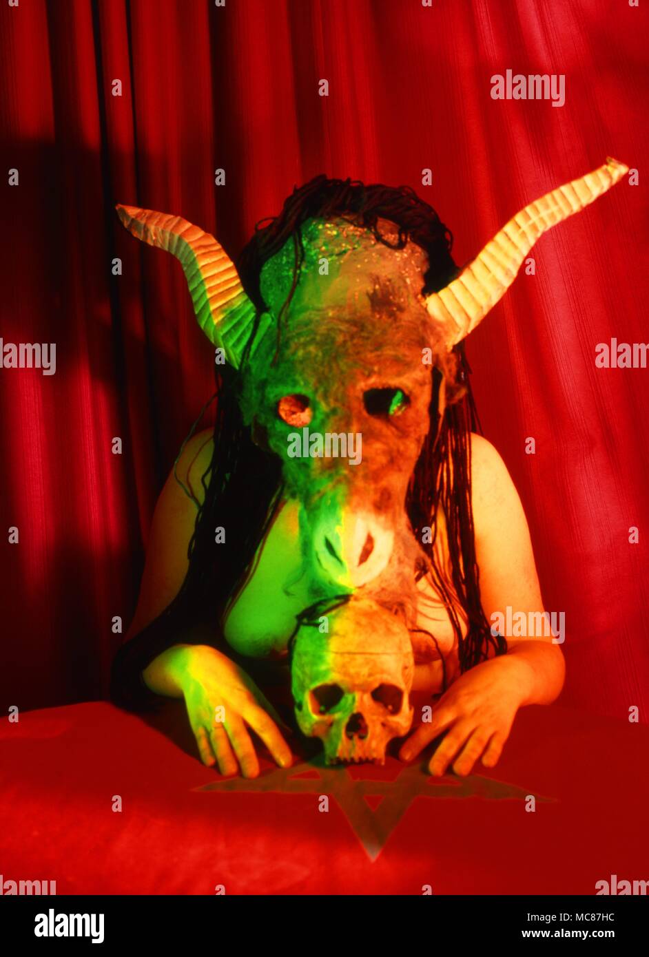Modern witch dressed and masked in the guise of the Sabbatic Goat of Witchcraft. Stock Photo