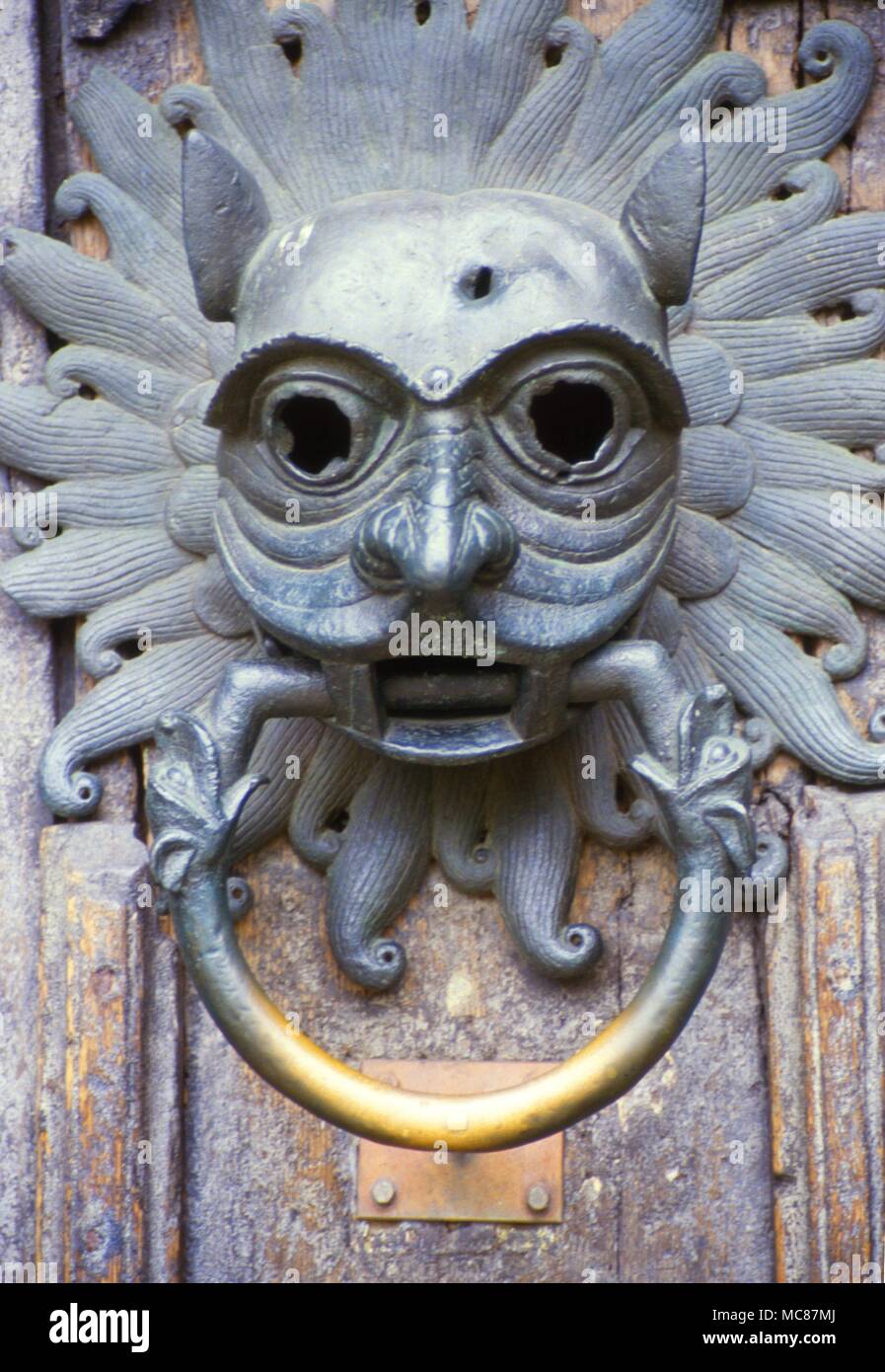 Sanctuary knocker of the thirteenth century in the form of a demon-head with solarized radiants behind the head. From the north door of Durham Cathedral. Stock Photo