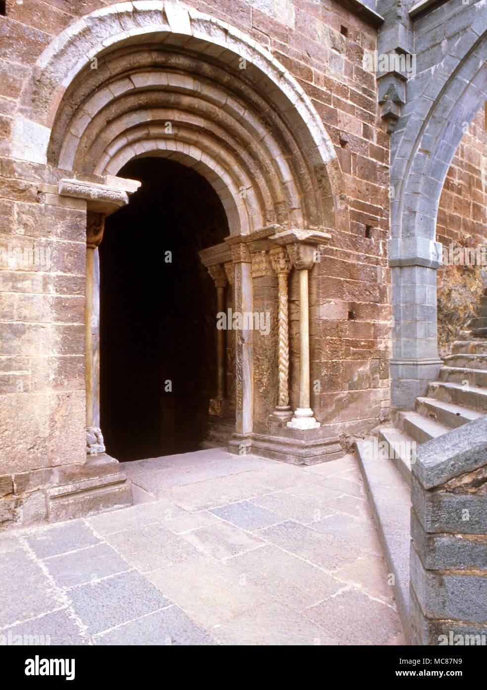 Astrological Site Susa Main doorway at the top of the staircase of the Dead with the outer section of the so called zodiacal arch at Sagra di San Michele Val di Susa Thirteenth Century Stock Photo