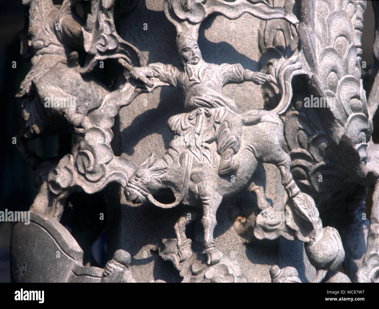 Chinese Mythology Eight immortals One of the Eight Immortals (Pa Hsien) from a column supporting a roof over a n external altar in a Chinese Temple in Penang Malaysia Each one of the eight Immortals is carved into the column Stock Photo