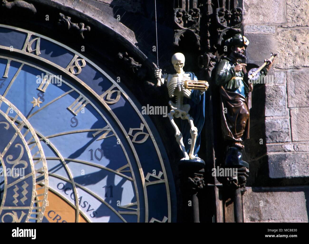 Death as a skeleton beating a drum - probably a representation of Saturn - on the clock face of the horlogium in the centre of Prague. Stock Photo