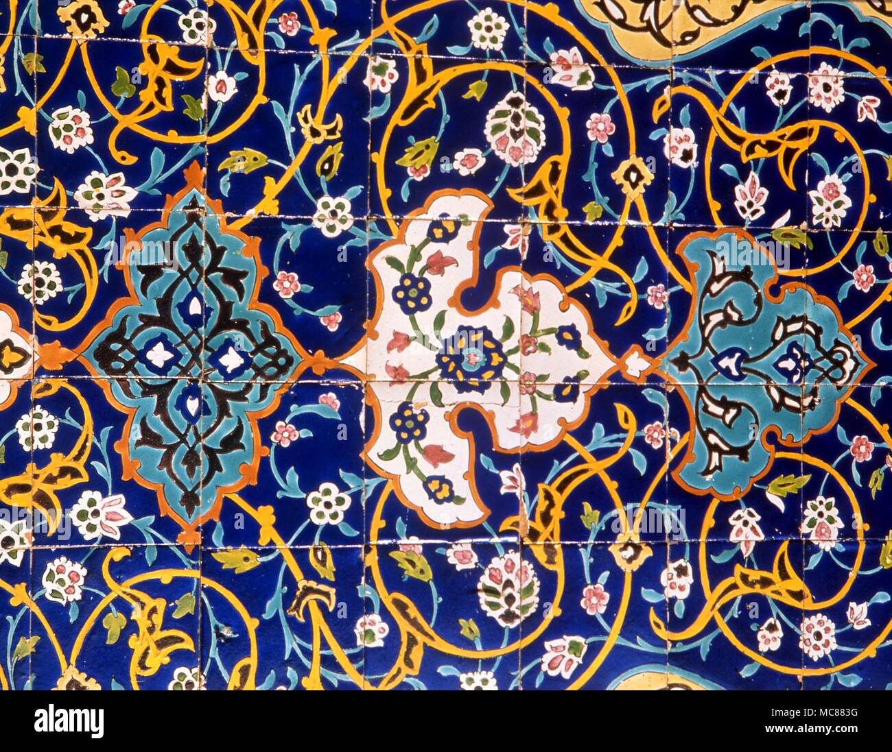 Islam. Tiles in the arabesque style so favoured by Islamic architects. Sample tiles from the outside of a mosque in Kuwait. Stock Photo