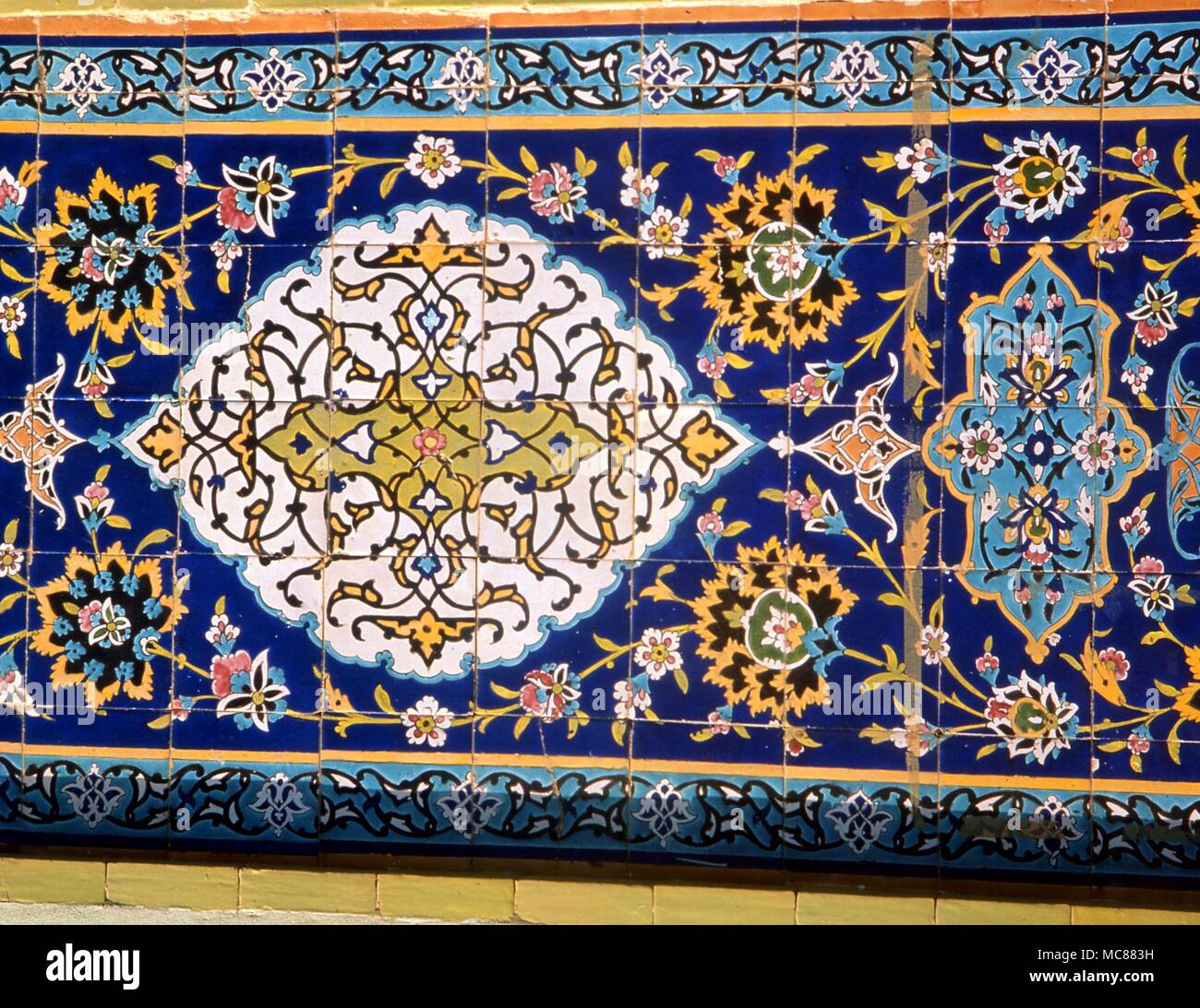 Islam. Tiles in the arabesque style so favoured by Islamic architects. Sample tiles from the outside of a mosque in Kuwait. Stock Photo