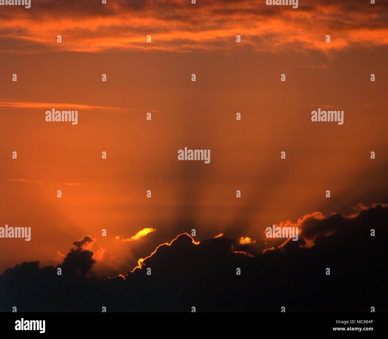 Moods of nature. Clouds at sunset with silver lining Stock Photo