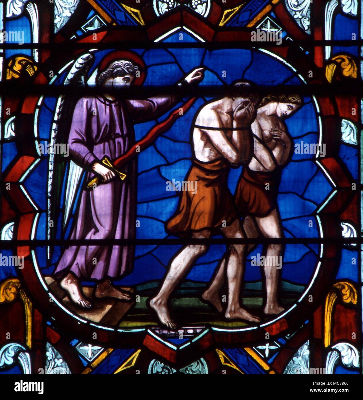 Christian Expulsion from the Garden Adam and Eve being driven from the Garden of Eden. Stained glass (9th century) from Lincoln Cathedral Stock Photo