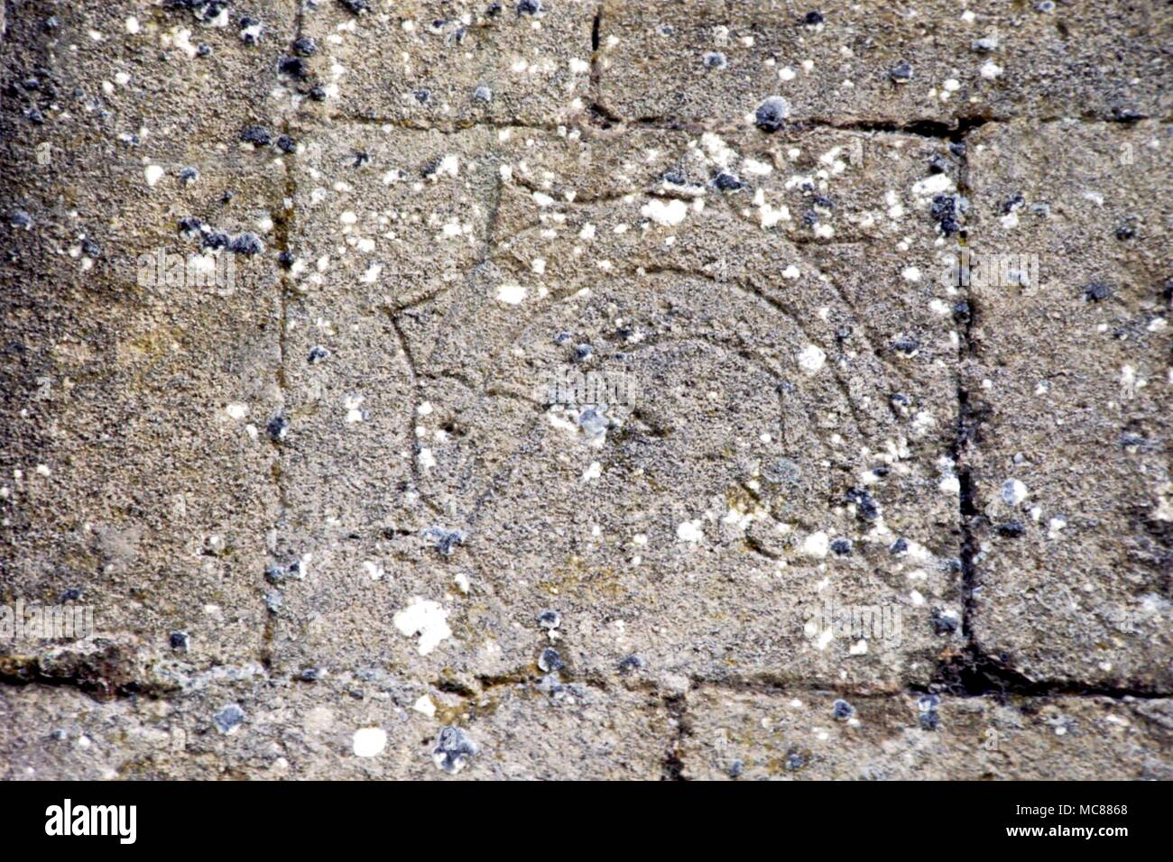 GLASTONBURY Sacred fish engraved high on the wall of the ruinous Abey of Glastonbury. The style would suggest that it was incised in the 14th century. The fish is a prime symbol of Christ Stock Photo