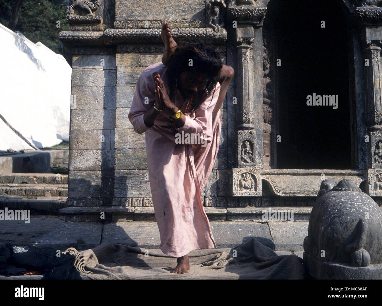 Yoga Fakir contorting his body in difficult yogic poses. Kathmandu Stock Photo