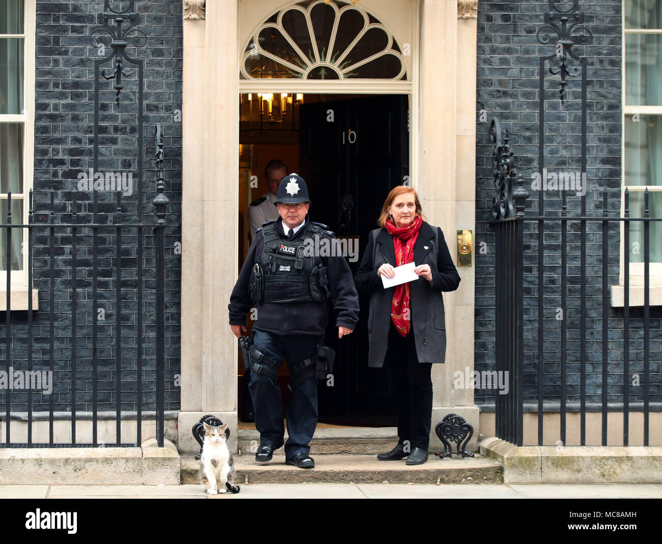 Emma Dent Coad, MP for Kensington, delivering a letter on behalf of Stop the War Coalition - signed by MPs, trade unionists, celebrities and academics to Downing Street urging Theresa May to not take military action in Syria - at 10 Downing Street in London. Stock Photo