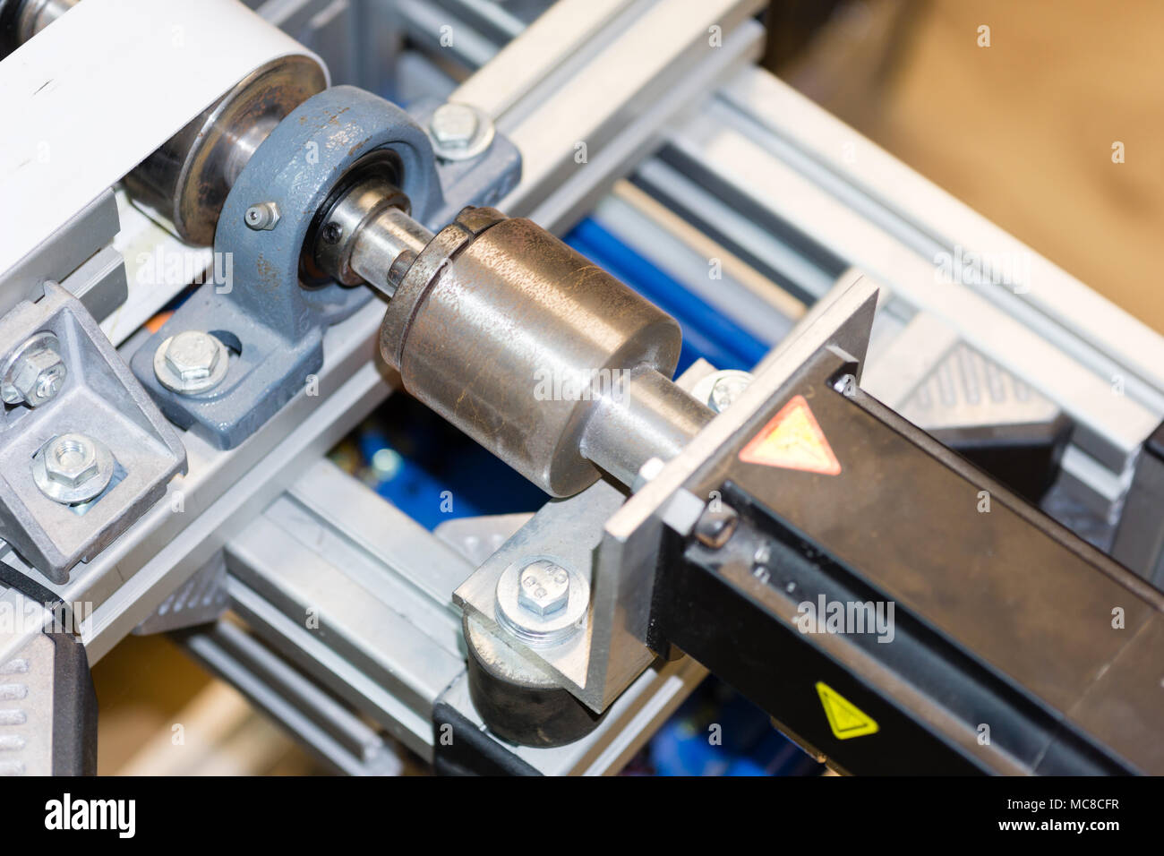 part of servo motor connected to the conveyor belt Stock Photo