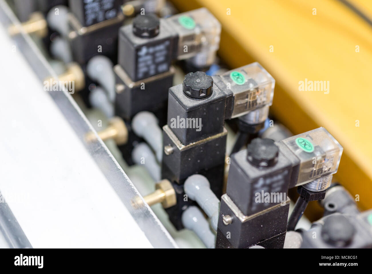 pneumatic components of industrial factory machinery installation close up Stock Photo