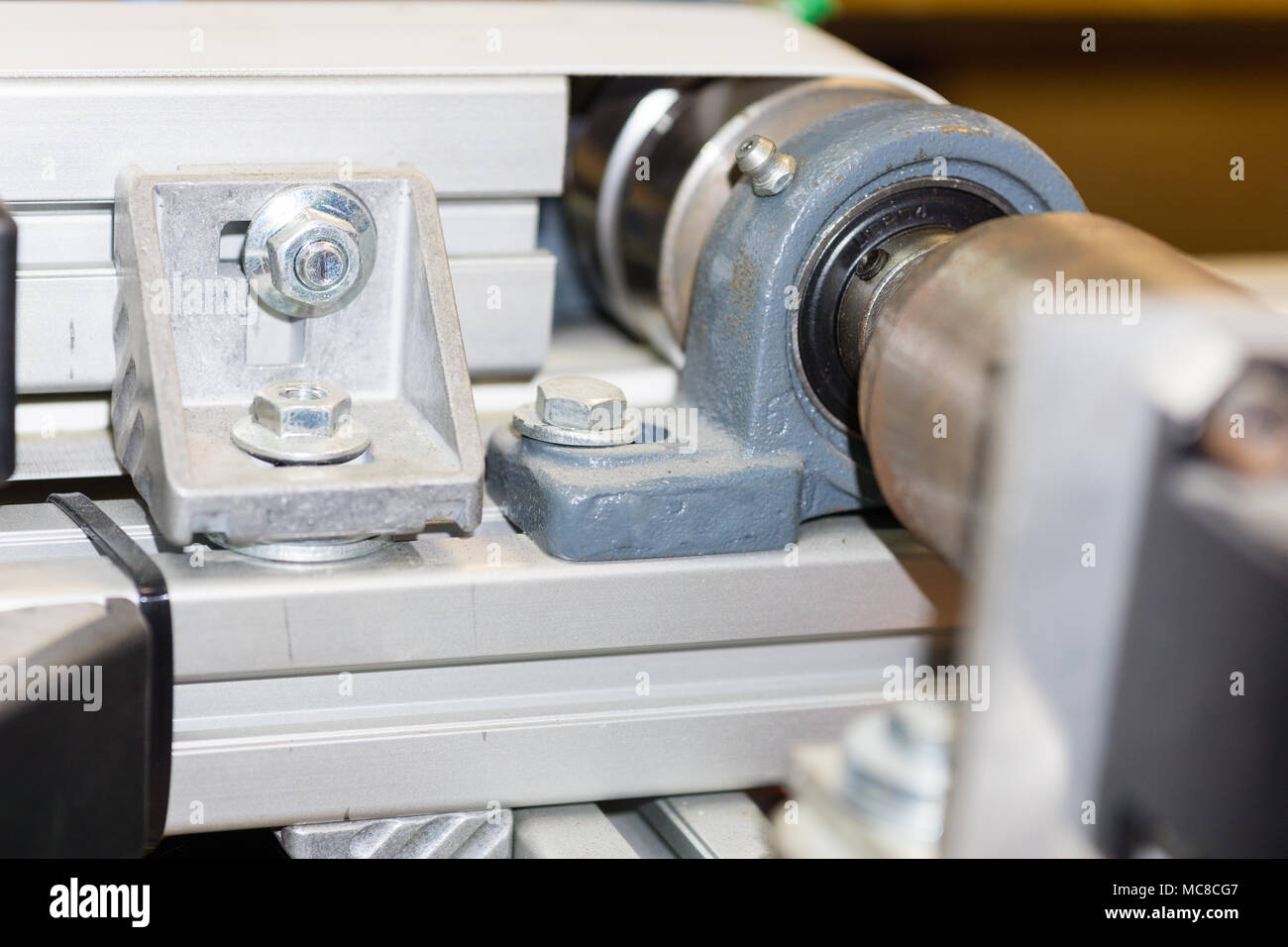 part of servo motor connected to the conveyor belt Stock Photo