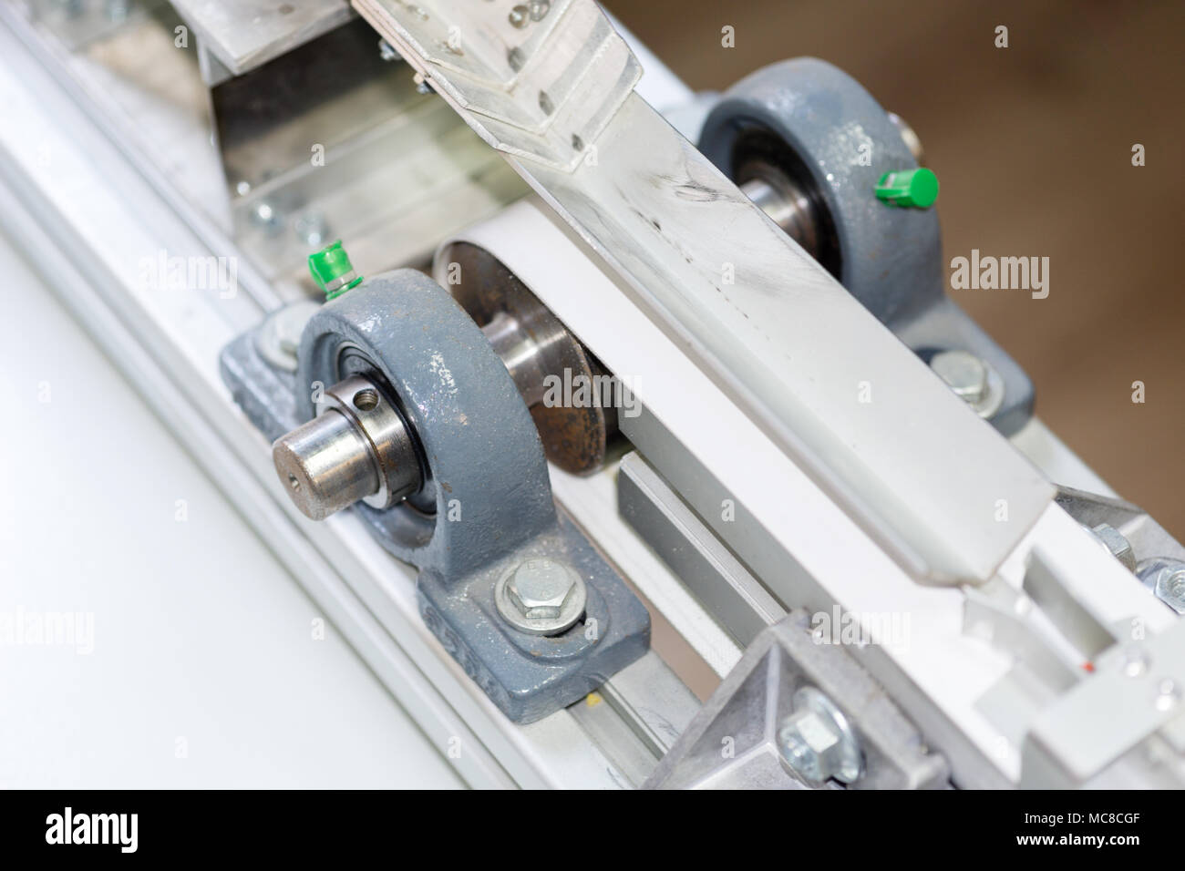 part of servo motor connected to the conveyor belt Stock Photo