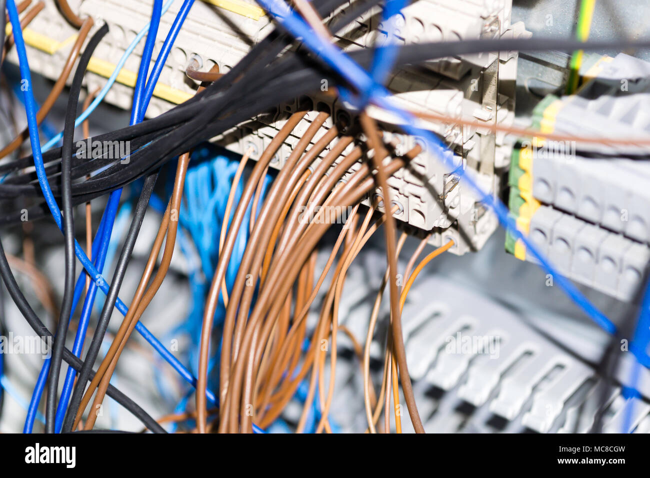 Electrical equipment components installation in fuse box. Wiring and connections. Stock Photo