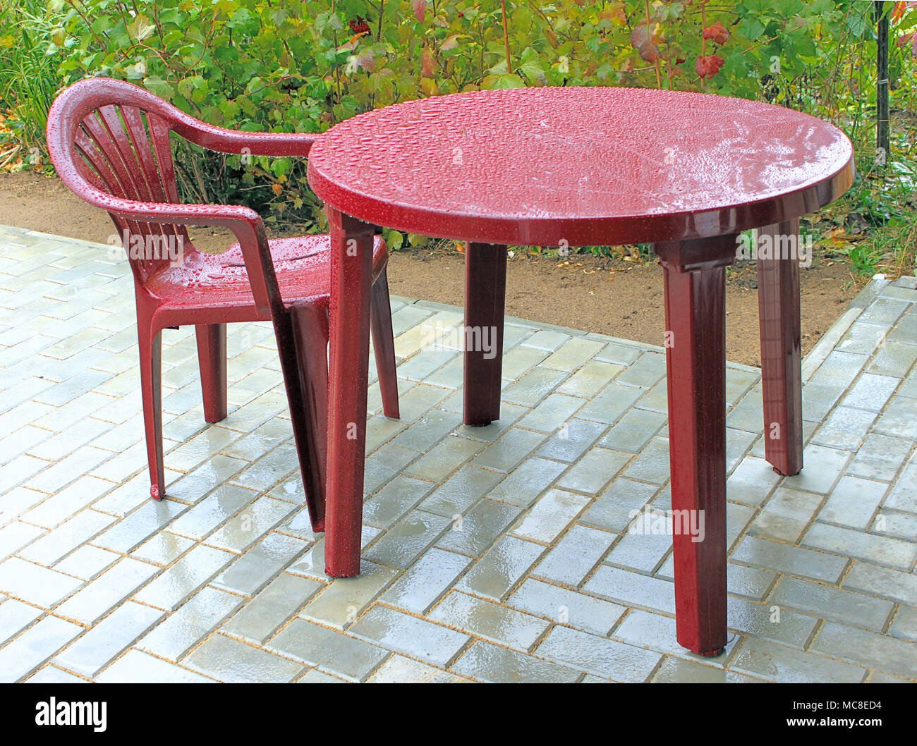 Plastic furniture during a rain on a patio Stock Photo Alamy