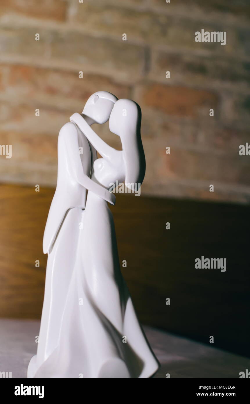 White Wedding Couple Figurines Kissing Cake Topper Stock Photo Alamy