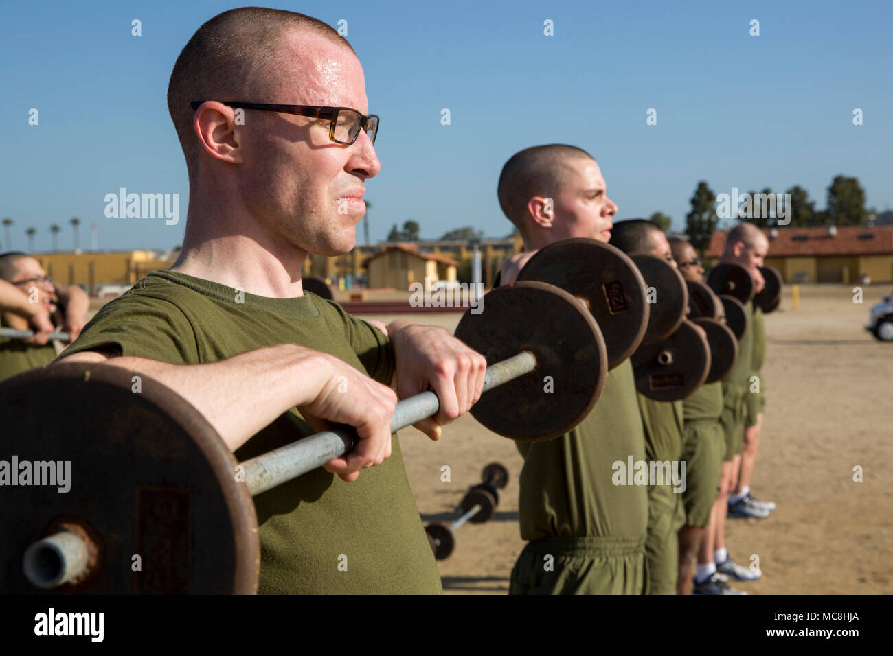 Recruits from Mike Company, 3rd Recruit Training Battalion, lift