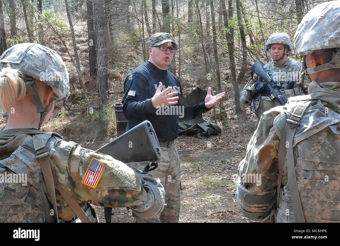 Staff Sgt. Christopher Penley, a combatives instructor, leads an after-action review following the training scenario. Stock Photo