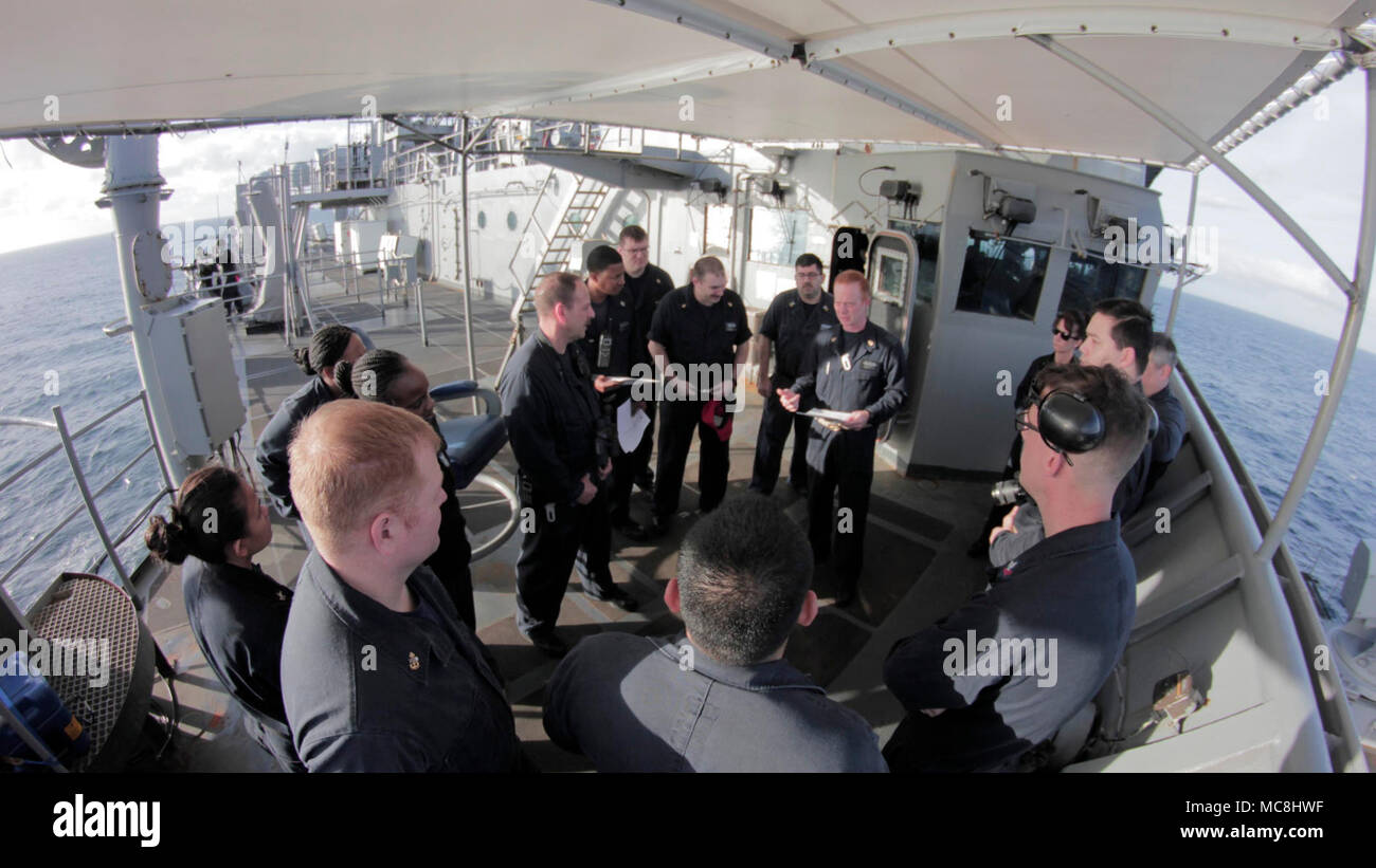 ATLANTIC OCEAN (Mar. 29, 2018) USS Gunston Hall (LSD 44) Damage Control Training Team conducts a General Quarters drill brief on the starboard bridge wing. Gunston Hall is underway participating in Carrier Strike Group FOUR Task Force Exercise in preparation for an upcoming deployment. Stock Photo