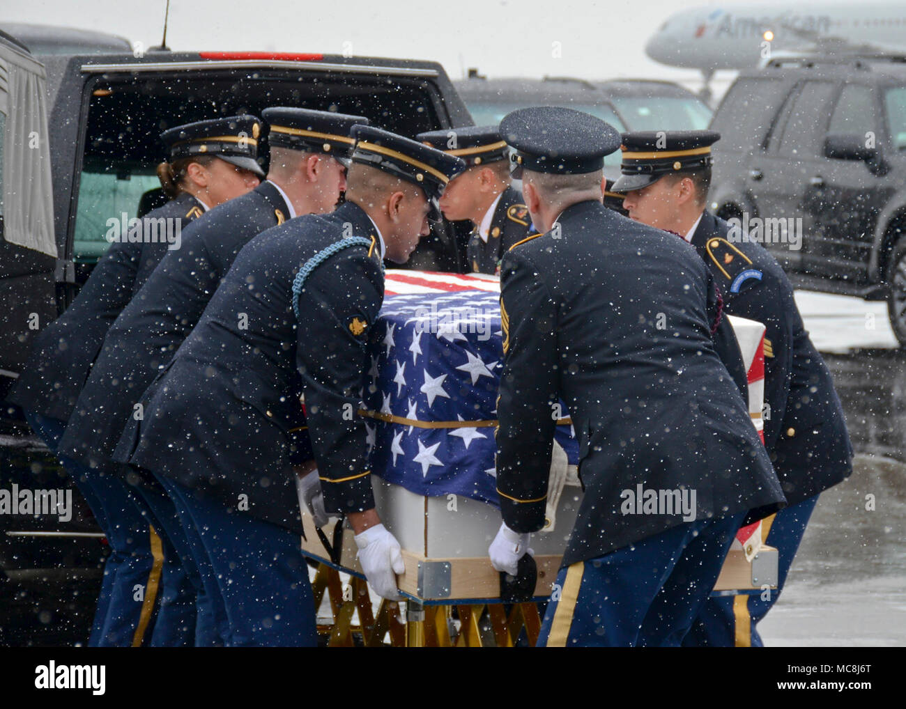 BOSTON (Apr. 2, 2018) The Military Funeral Honors Team of the Massachusetts Army National Guard carries the casket of Medal of Honor Recipient Capt. Thomas J. Hudner, Jr., USN, to a plane for transport to Arlington National Cemetery for his final internment. Capt. Hudner, a naval aviator, received the Medal of Honor for his actions during the Battle of the Chosin Reservoir during the Korean War. Stock Photo