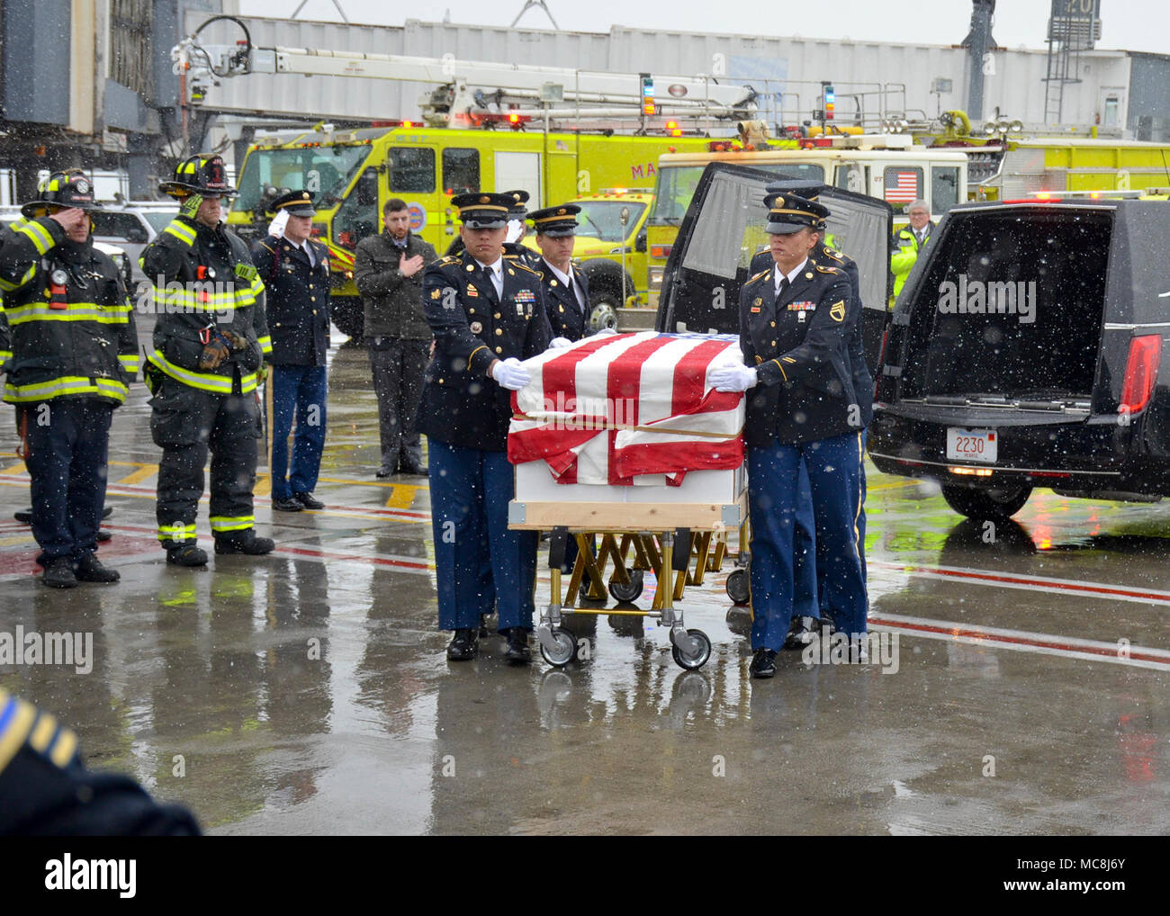 BOSTON (Apr. 2, 2018) The Military Funeral Honors Team of the Massachusetts Army National Guard carries the casket of Medal of Honor Recipient Capt. Thomas J. Hudner, Jr., USN, to a plane for transport to Arlington National Cemetery for his final internment. Capt. Hudner, a naval aviator, received the Medal of Honor for his actions during the Battle of the Chosin Reservoir during the Korean War. Stock Photo
